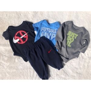Nike. 2 short sleeve onesies. 2 long sleeve onesie. 2 sweatpants.